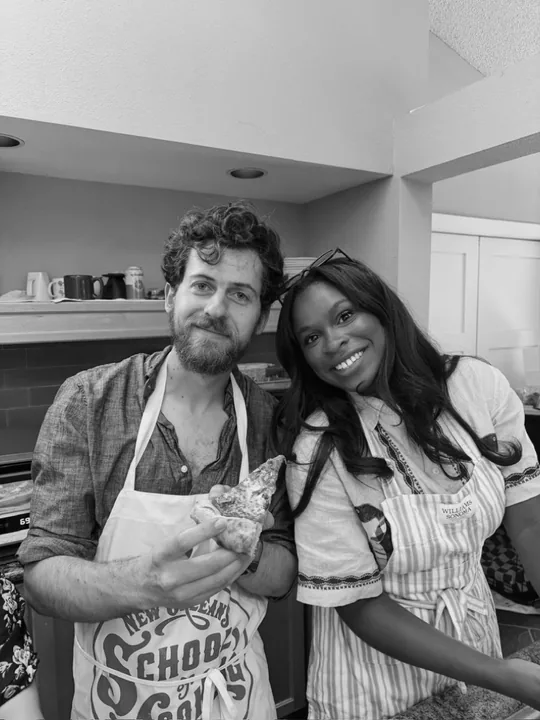 Cooper and Ciera cooking together in aprons