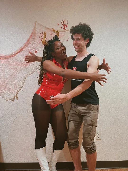 Ciera and Cooper dancing together in a studio