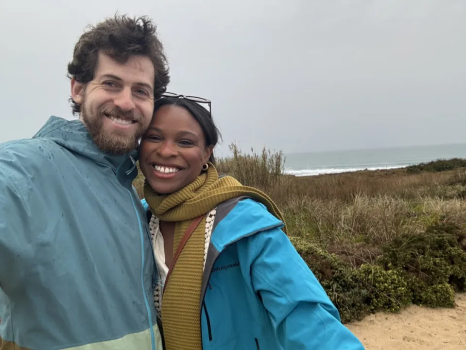 Cooper and Ciera bundled up on a windy hilltop