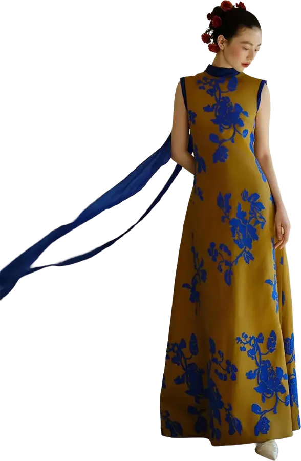 Mustard qipao-style gown with a blue floral print and ribbon sash
