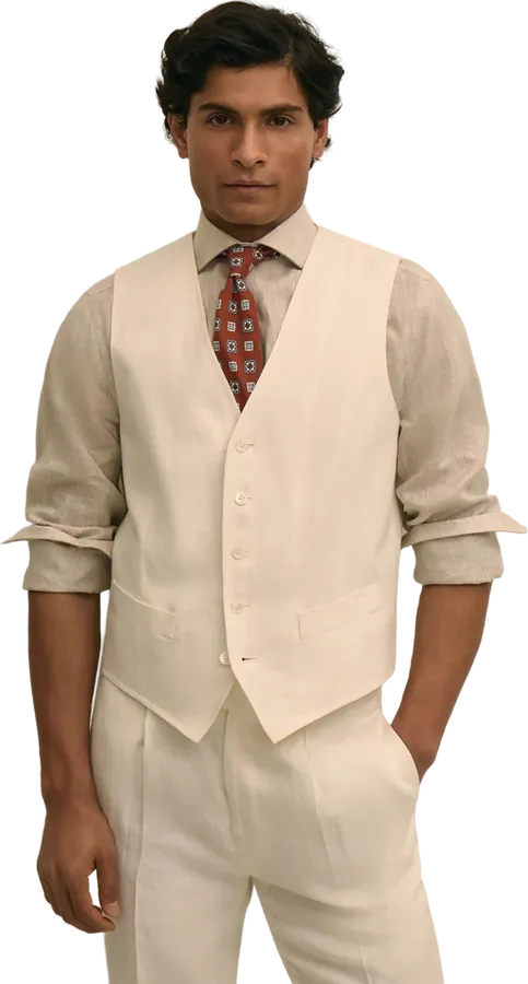 Cream vest and trousers with a patterned tie