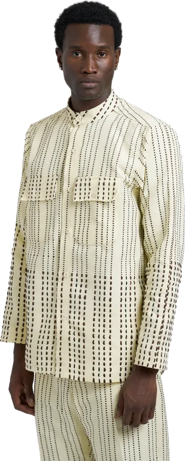 Cream shirt-jacket and trousers with a black dash print