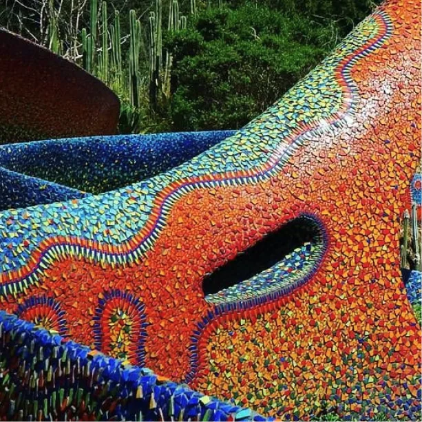 A mosaic serpent sculpture in bright tiles